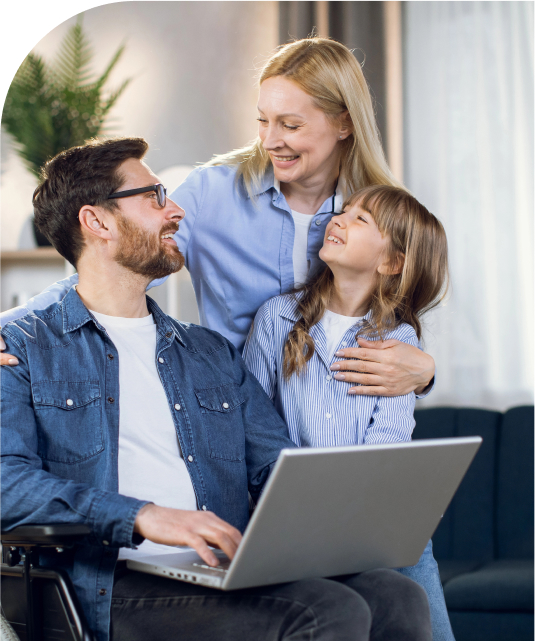 Family with disabled parent smiling together